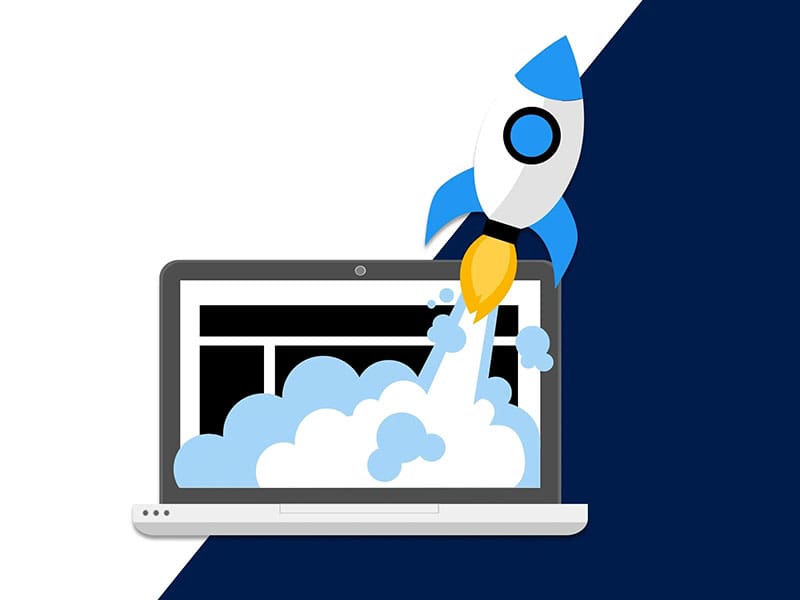 A rocket is flying over an open laptop.