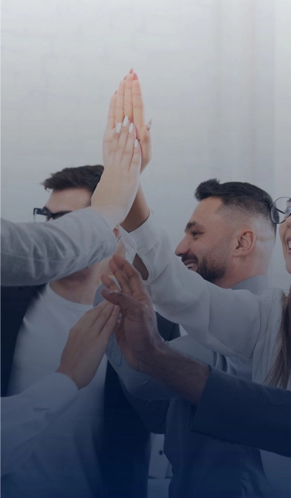 A group of people giving each other a high five.